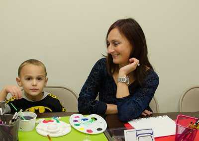 Small boy and his mother at birthday party