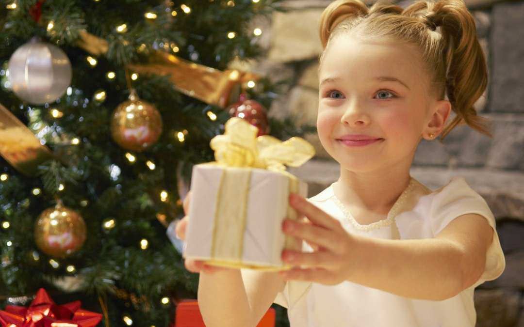 Girl receive a gift for the Holidays