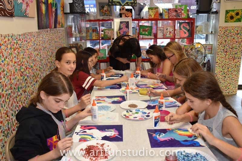 Girls creating the unicorn mosaic