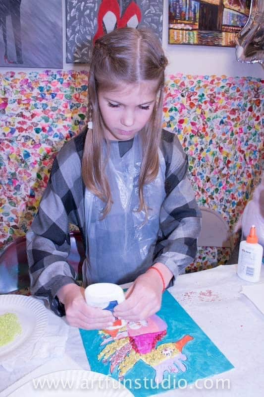 Girl making mosaic during a birthday