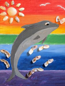 mixed media project with jumping dolphin