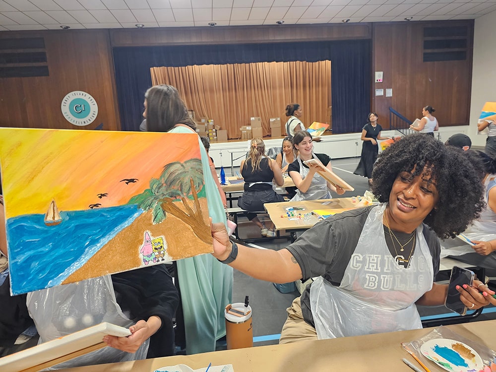 Happy teacher display her artwork